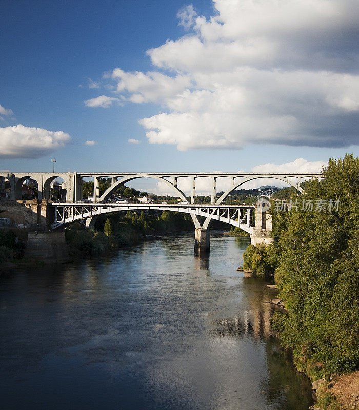 Road and railway bridges over Mi?o river in Ourense, Spain .